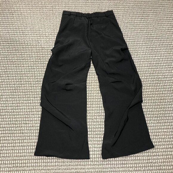 Black baggy slacks with folds. Beautiful peice, the folds make it sit right, so - Picture 5 of 6